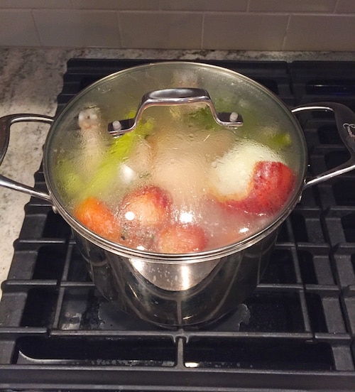 Chicken Stock Simmering on Stove 