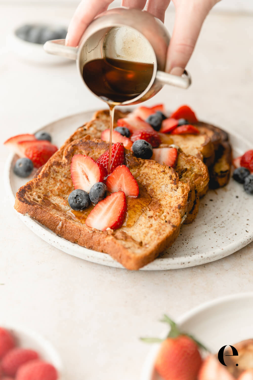 French Toast on Plate with Berries and Maple Syrup drizzle Elizabeth Rider