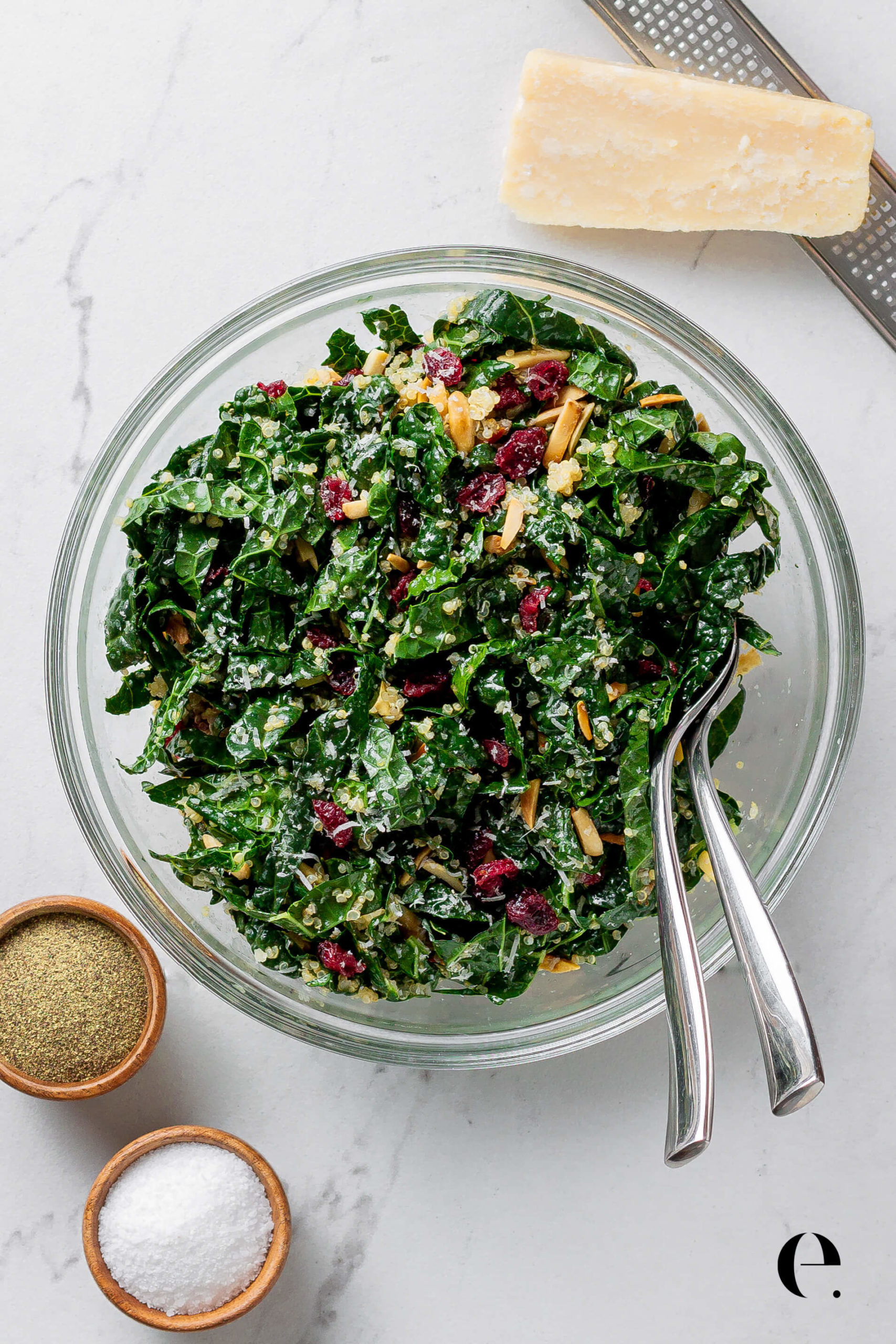 Cranberry, Kale & Quinoa Salad in bowl with spoons