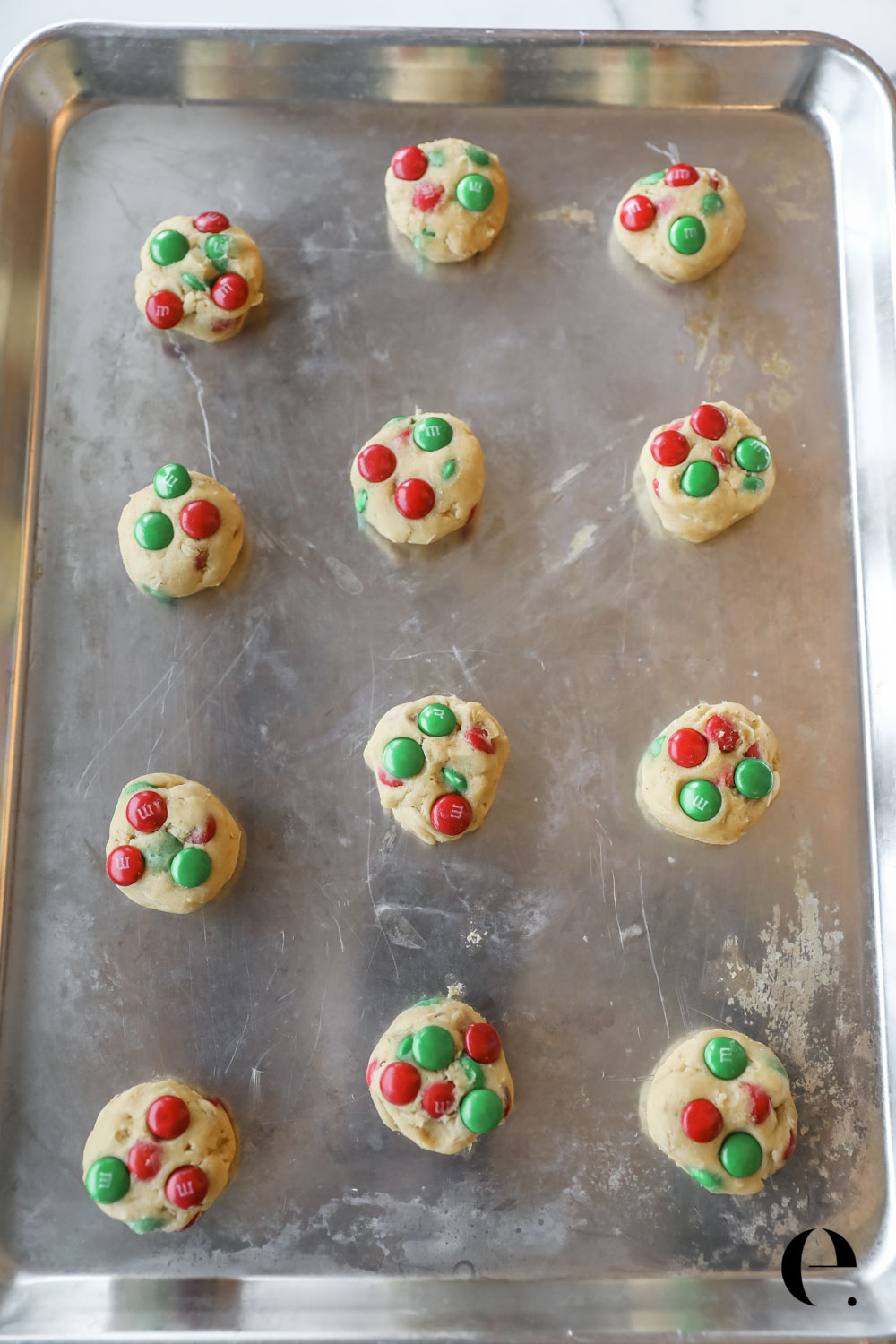raw cookie dough balls on baking sheet