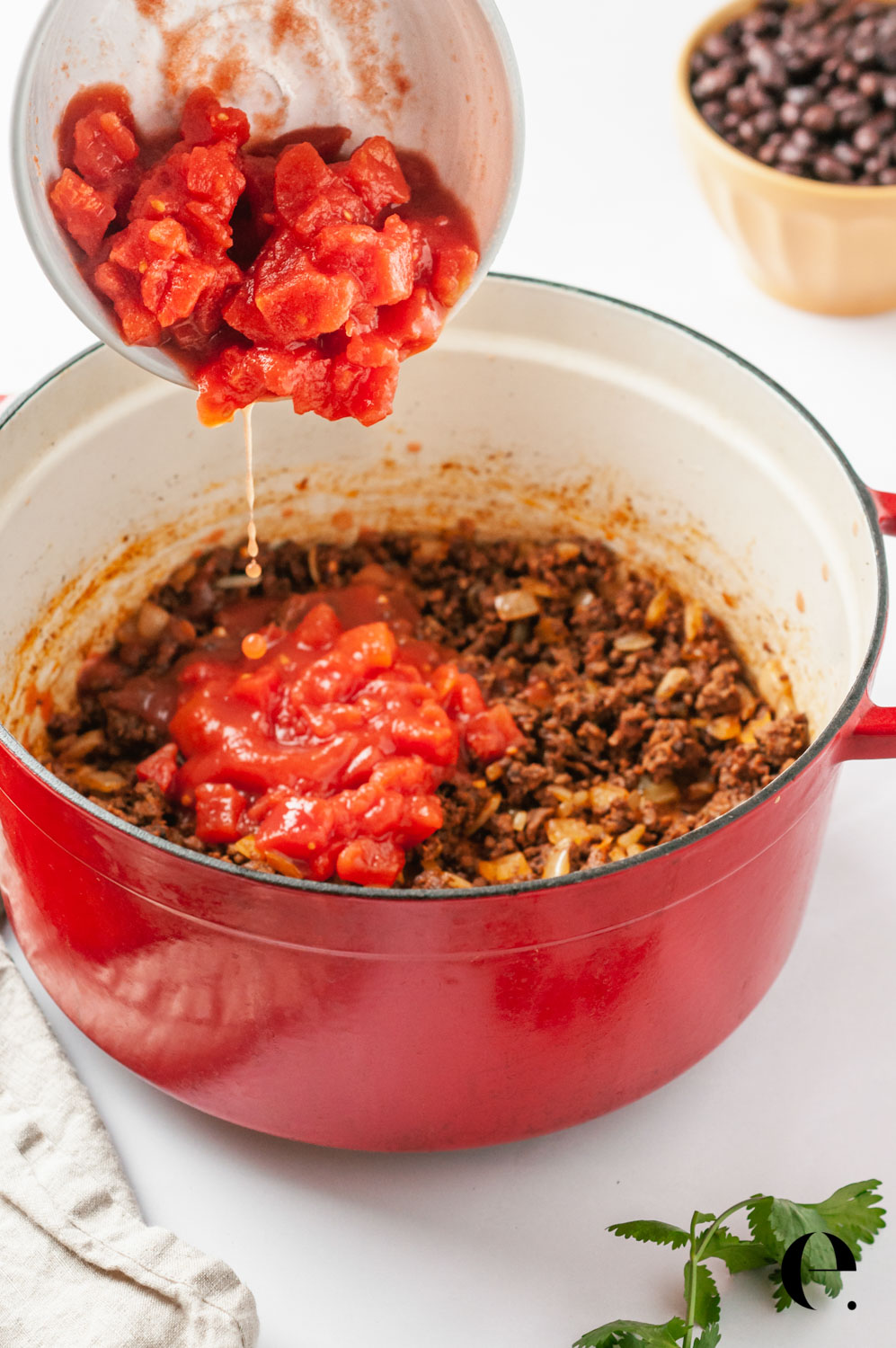 tomatoes and ground beef in pot