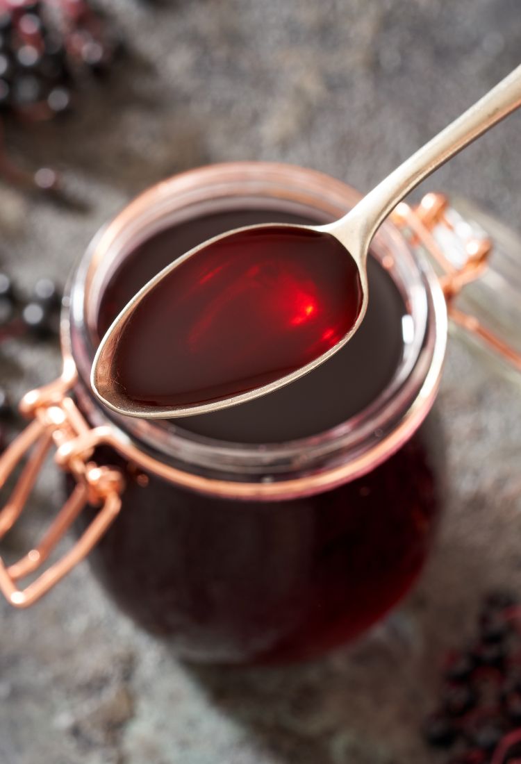 Elderberry Syrup Recipe in jar with spoon