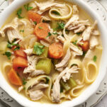 Homemade Chicken Noodle Soup Recipe with carrots & celery in bowl