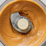 Homemade Thai peanut sauce blended in a food processor until smooth and creamy social