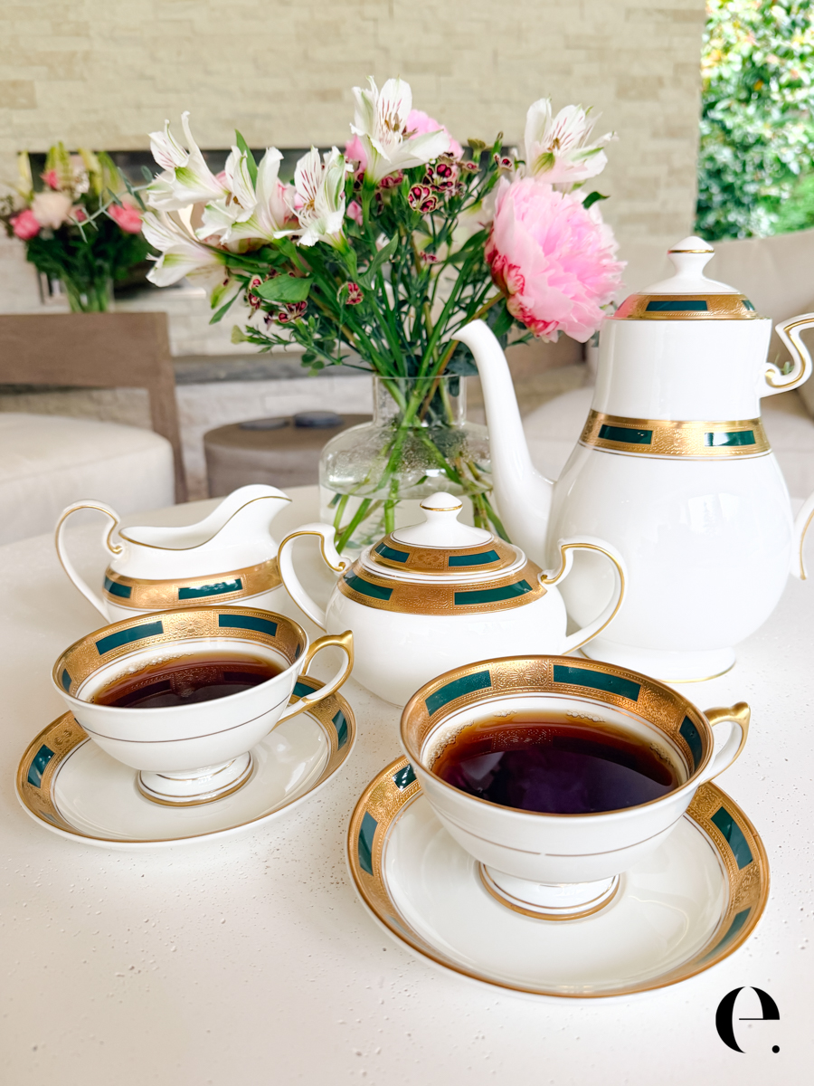 Aynsley Empress Tea Set on table outside with milk pouring