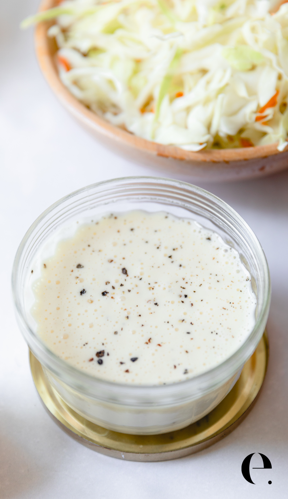 Easy Homemade Coleslaw Recipe with dressing and cabbage in a bowl