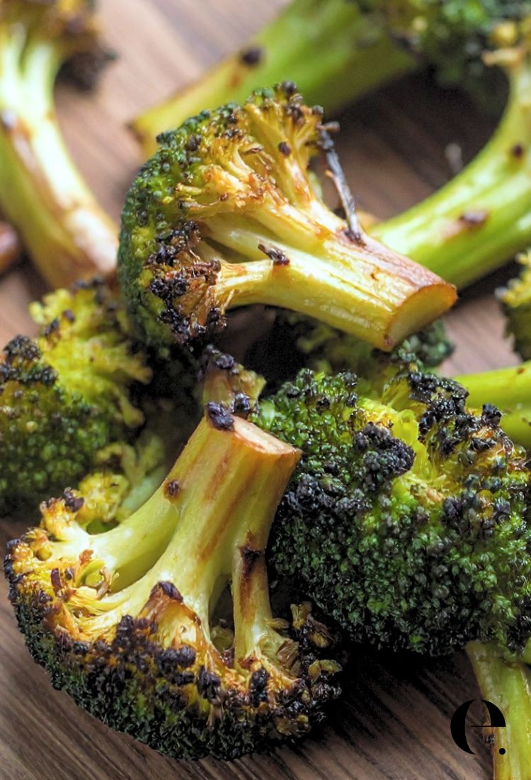 close up Roasted Broccoli with brown crispy edges on cutting board