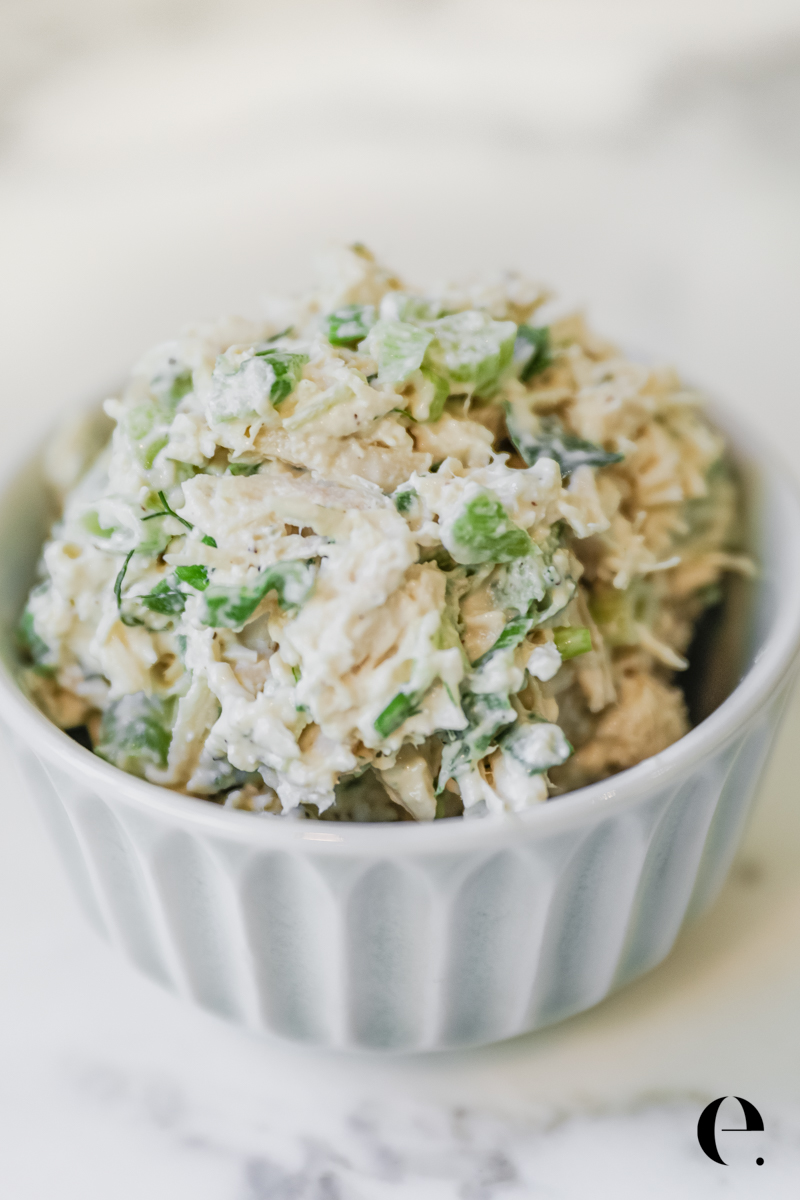 Bowl of classic chicken salad with celery, green onion, and fresh dill