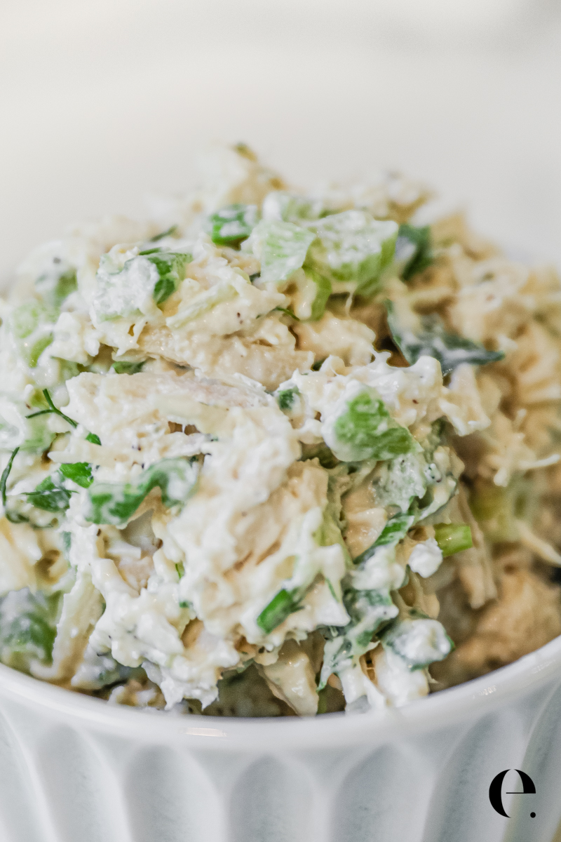 Close up Classic Chicken Salad Recipe for sandwiches with celery and green onion in bowl