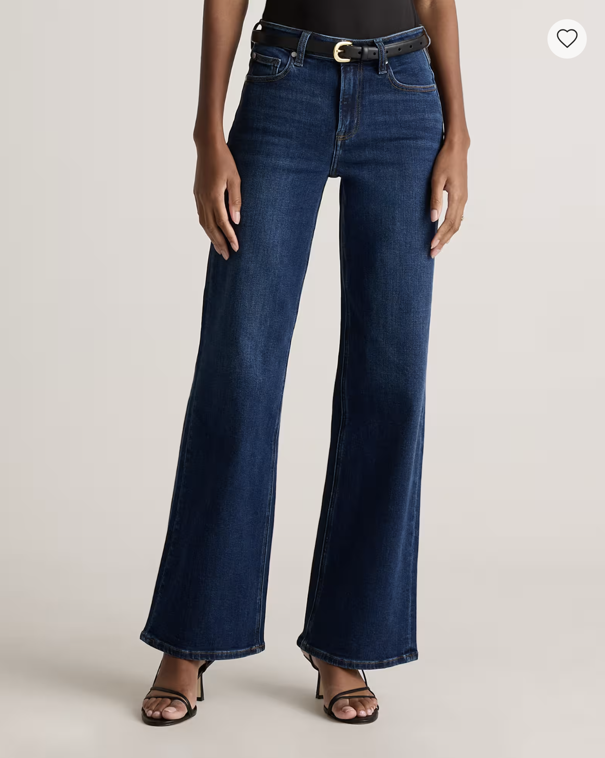 Quince Bella Stretch Wide-Leg Jeans in a dark blue wash, styled with a black top, belt, and heels.