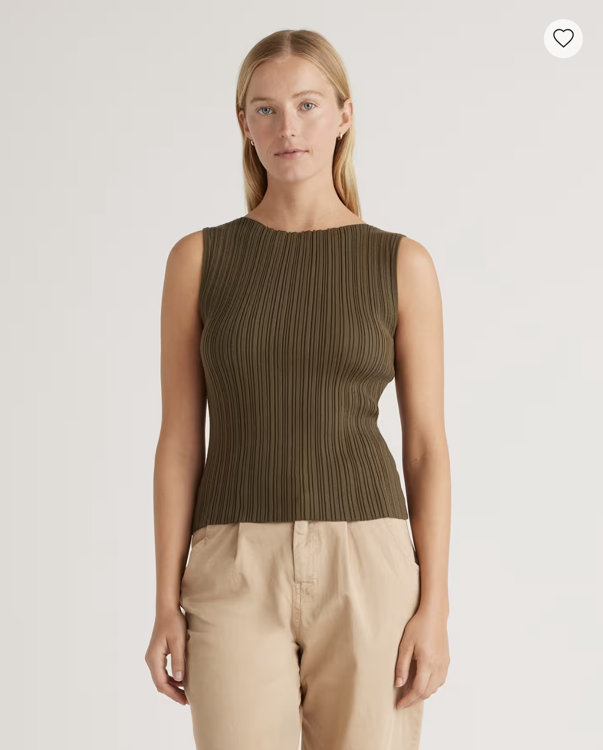 Model wearing the Quince Cotton Cashmere Ribbed Tank in olive brown with beige trousers.