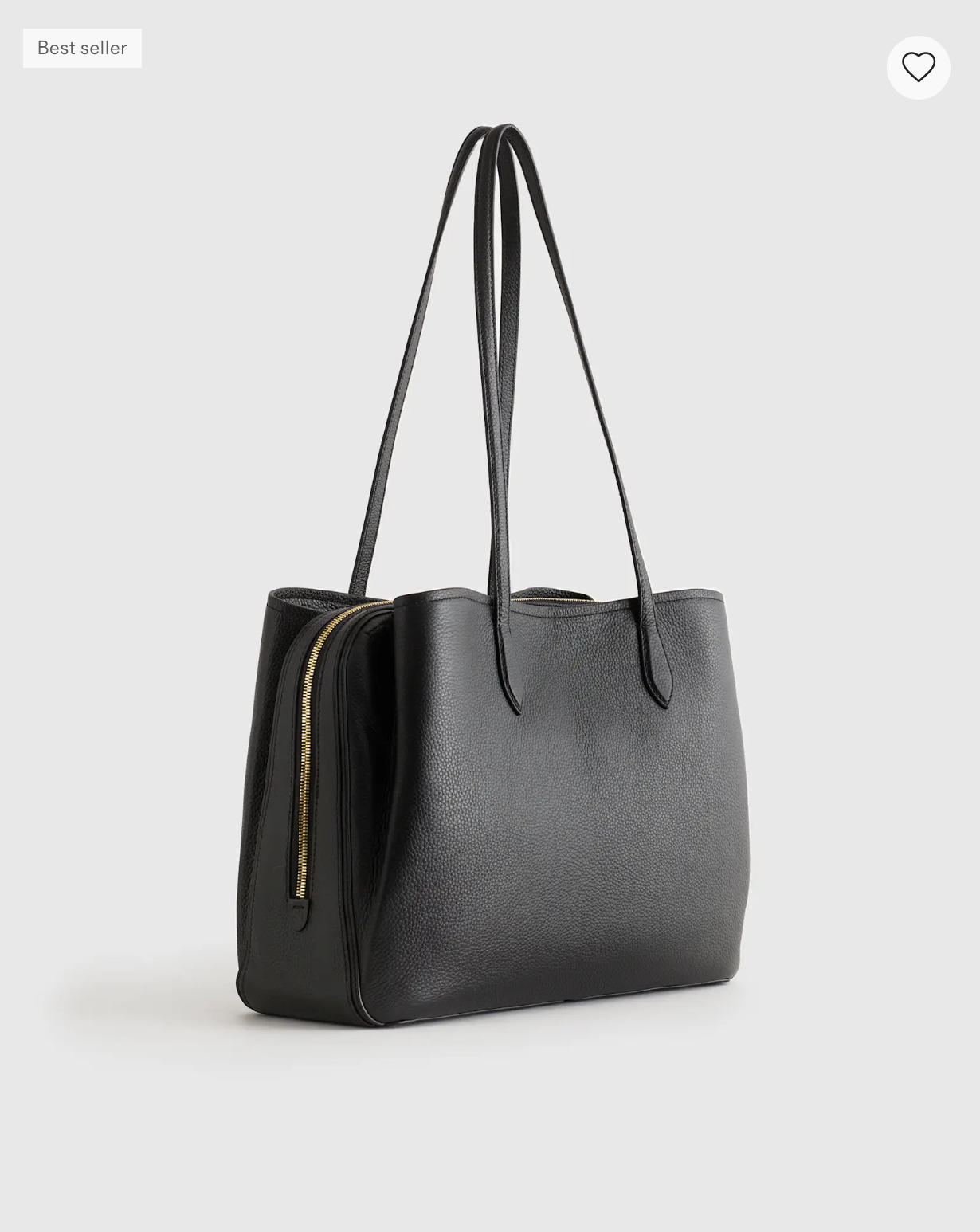 Quince Vivienne Work Tote in black pebbled leather with long shoulder straps and a gold side zipper.