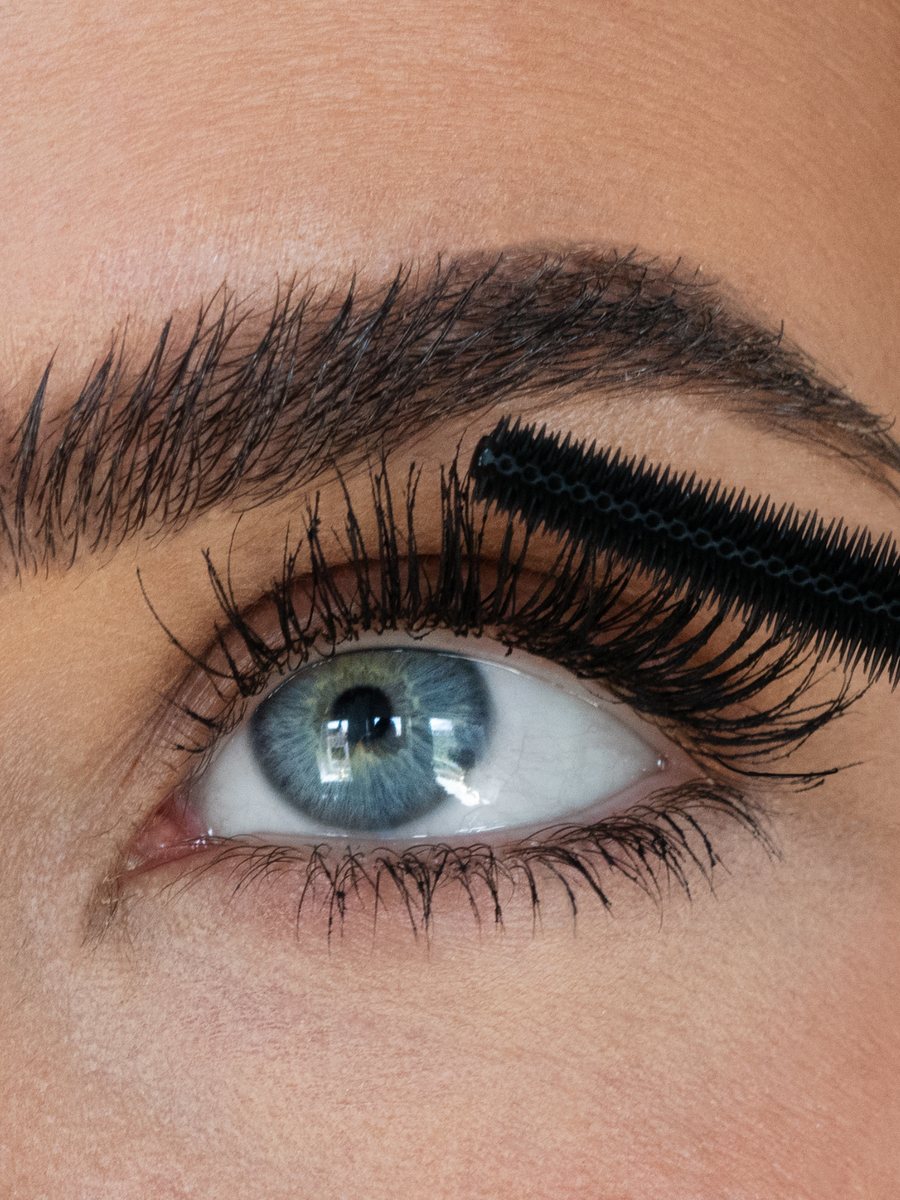 Close-up of Sweed Cloud Mascara being brushed onto upper lashes